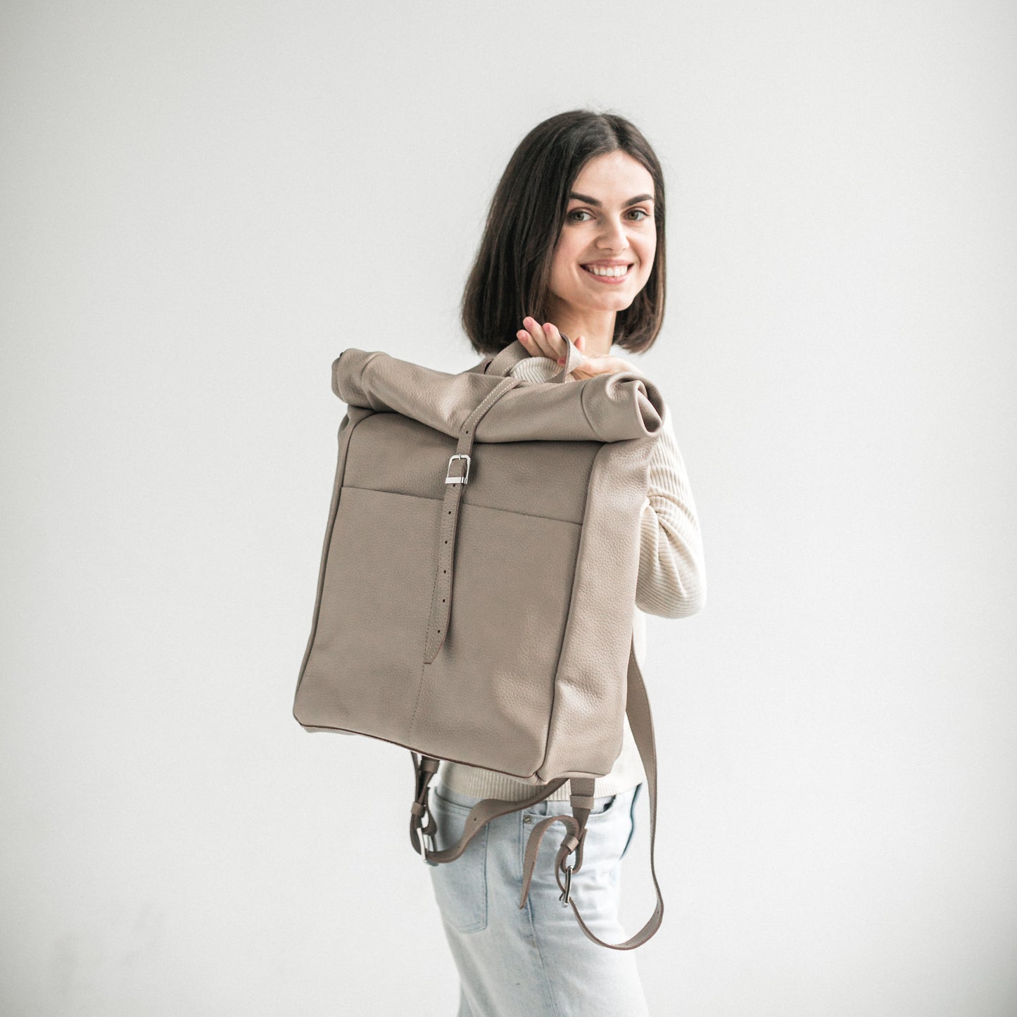 Beige pebbled leather roll-top backpack