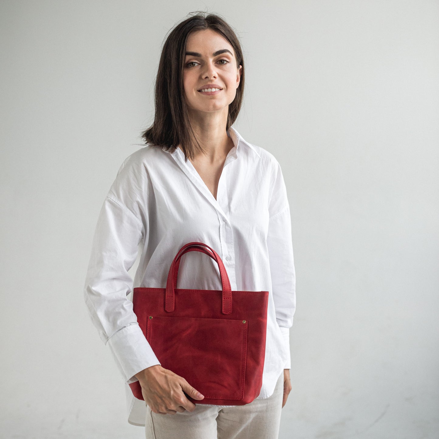 Leather mini tote bag with outside pocket