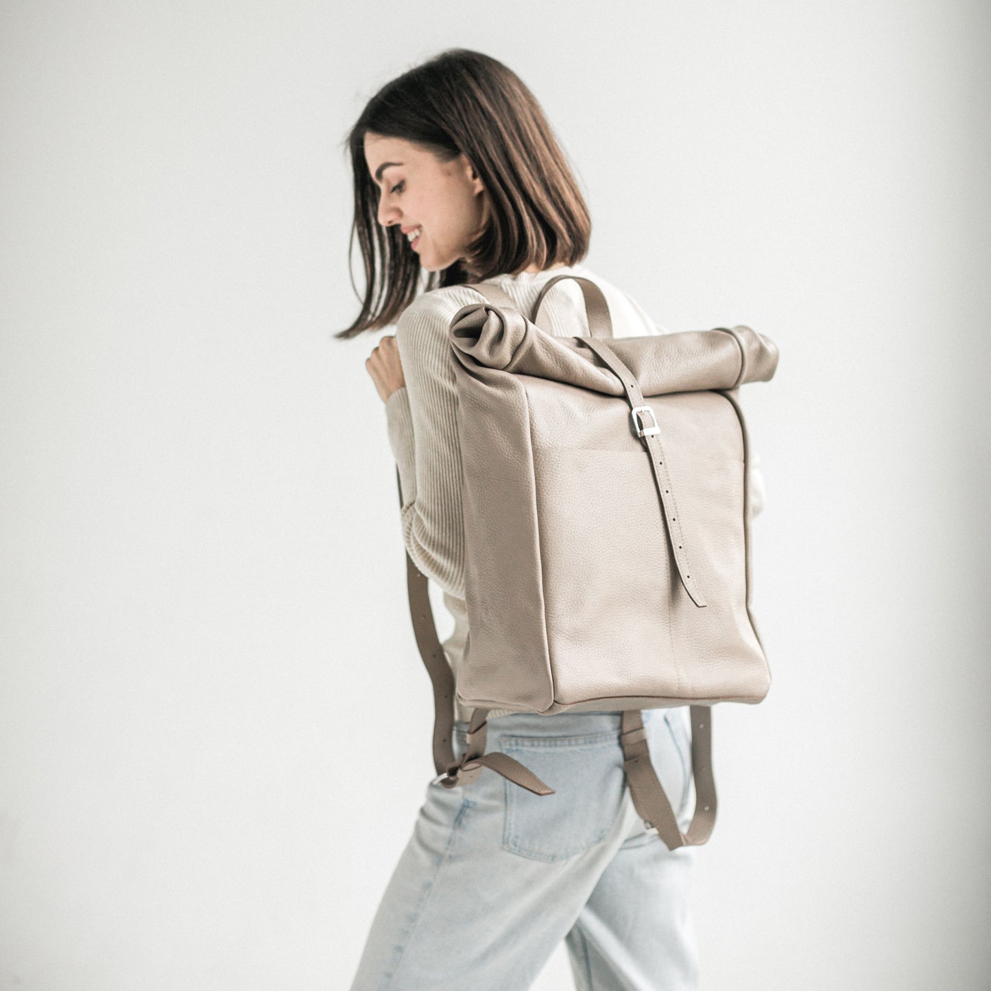 Beige pebbled leather roll-top backpack