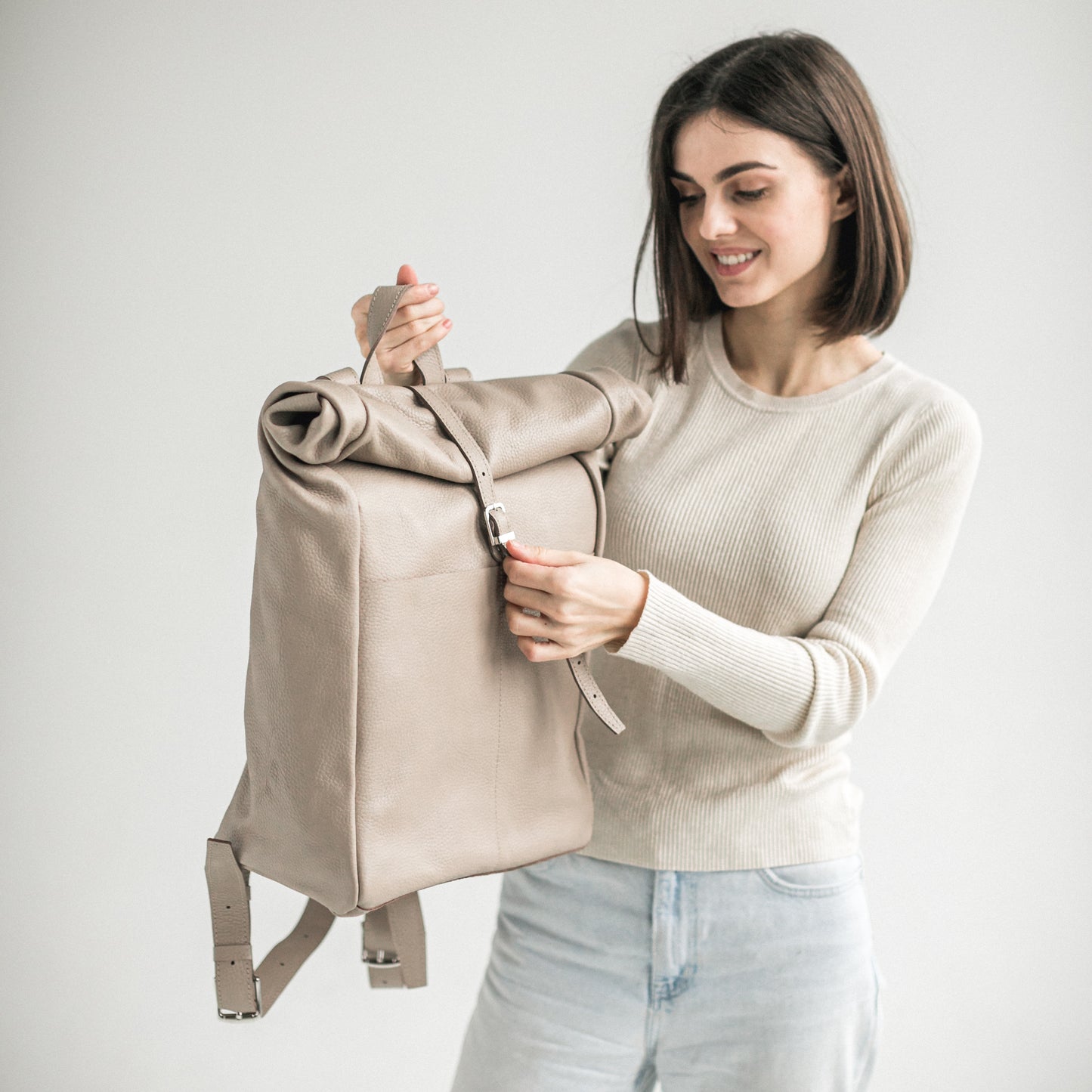 Beige pebbled leather roll-top backpack