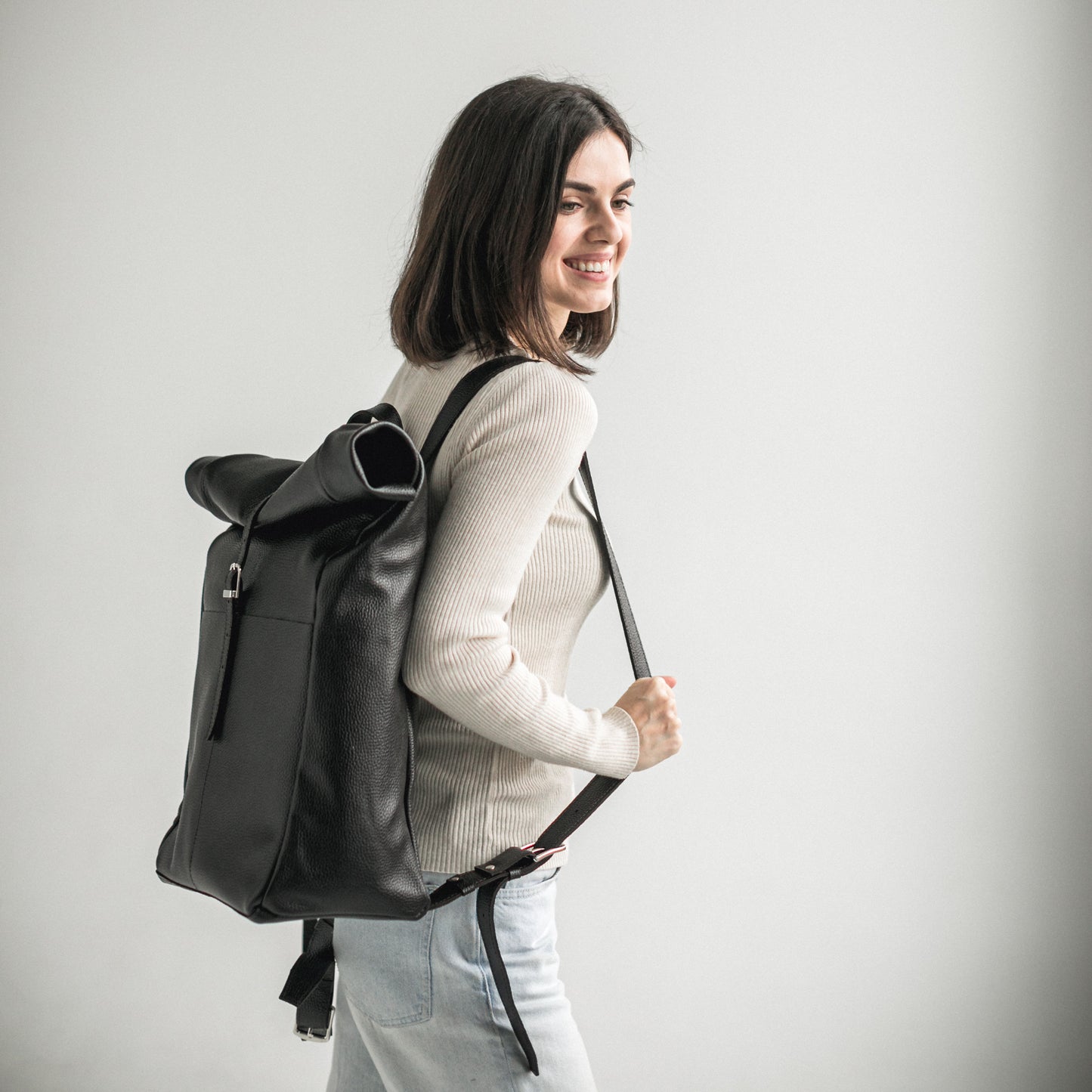 Black pebbled leather roll-top backpack