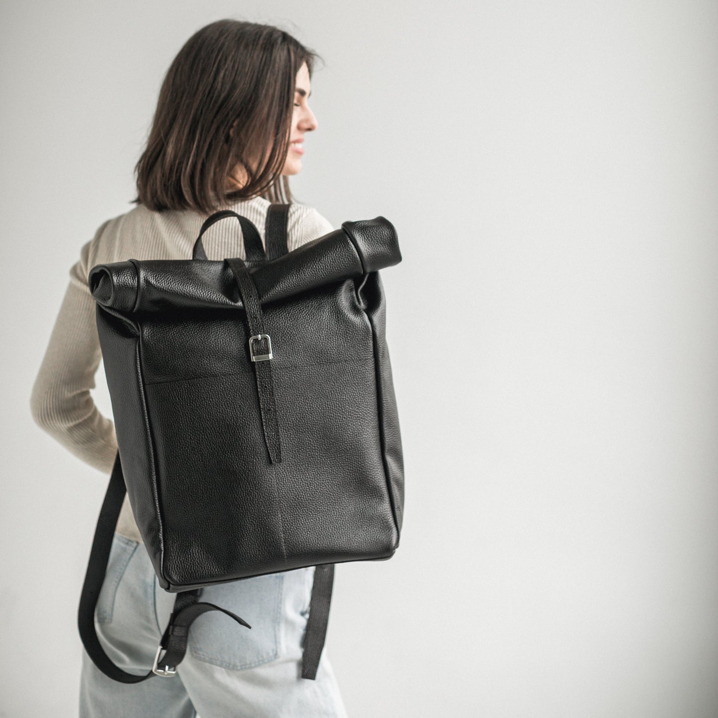 Black pebbled leather roll-top backpack