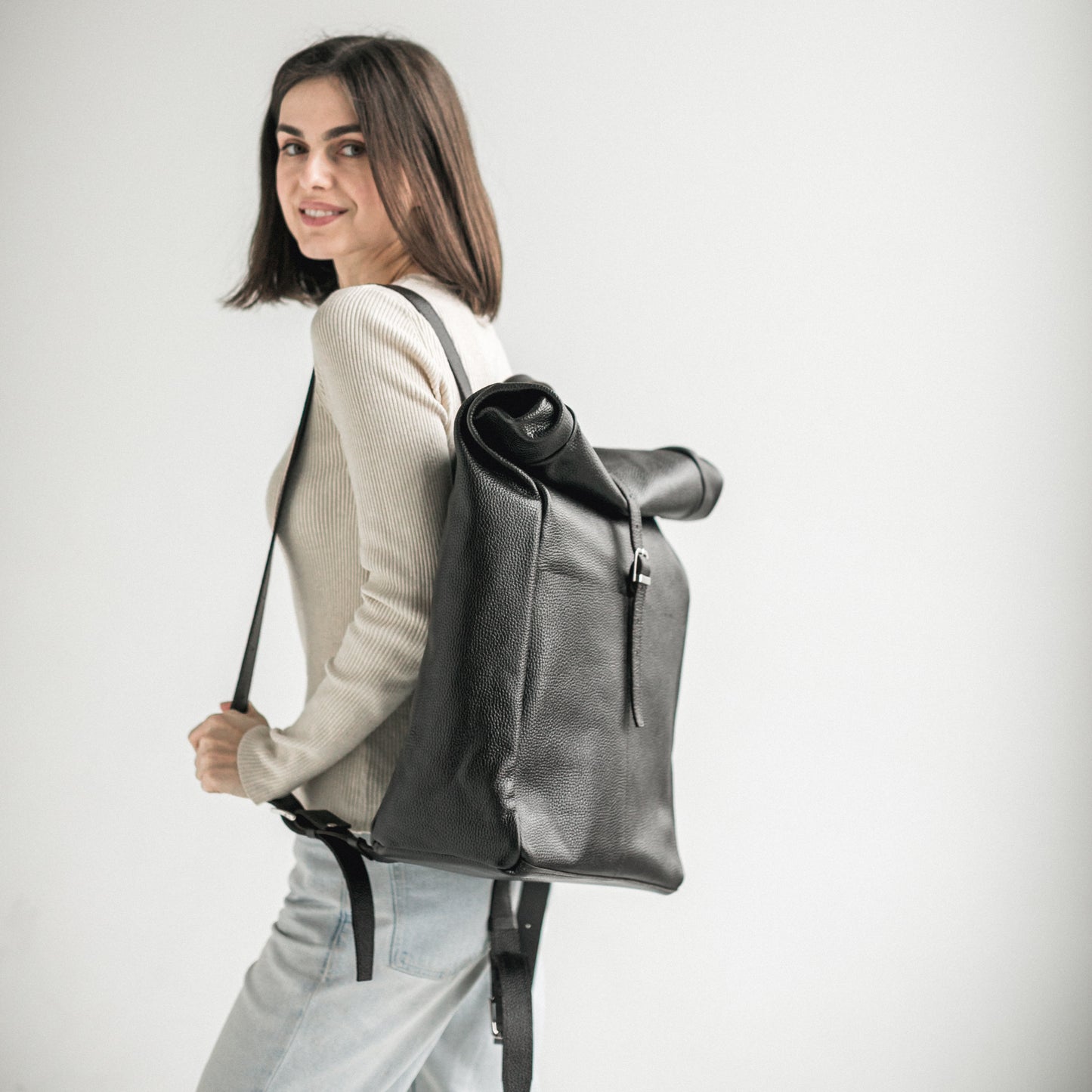 Black pebbled leather roll-top backpack