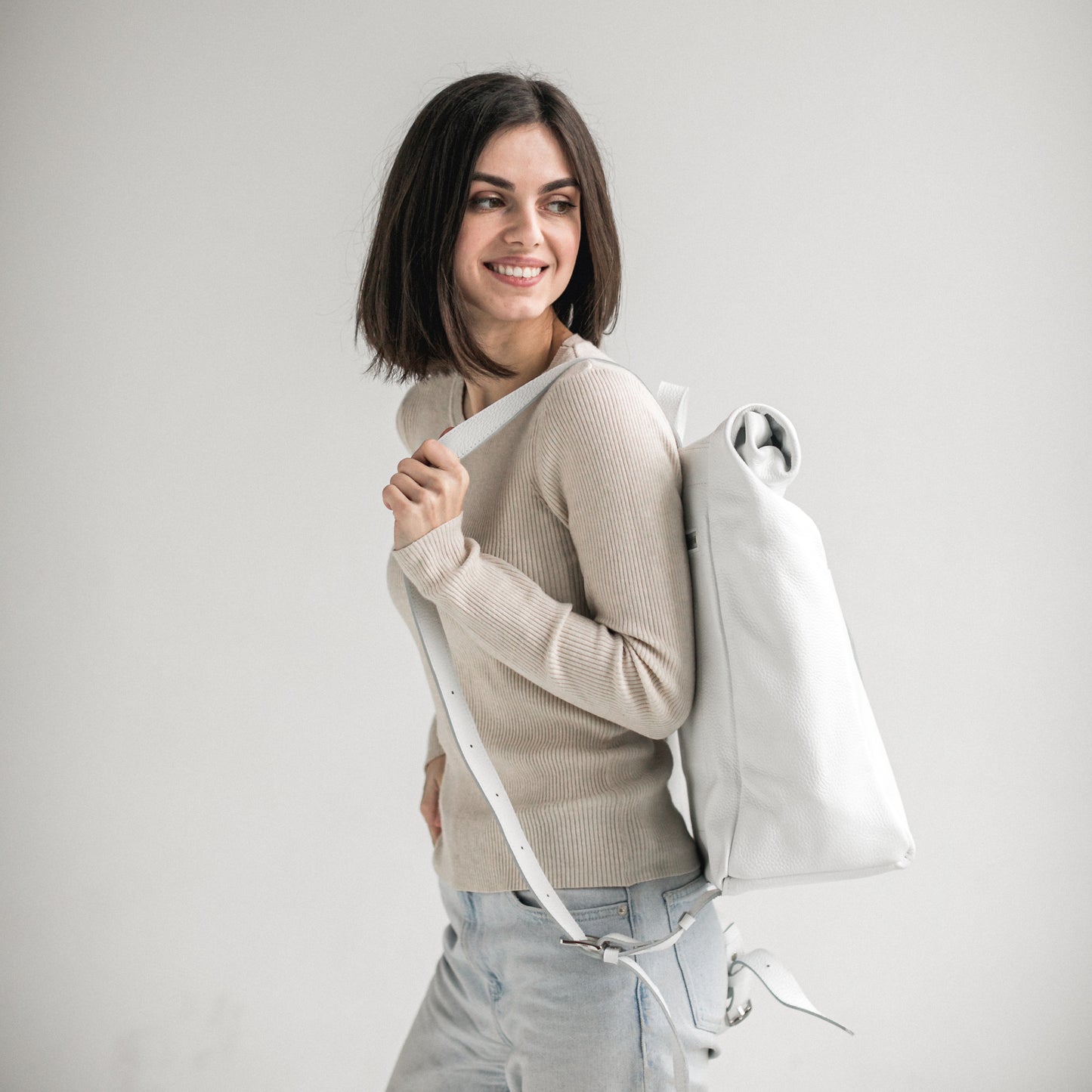 White pebbled leather roll-top backpack