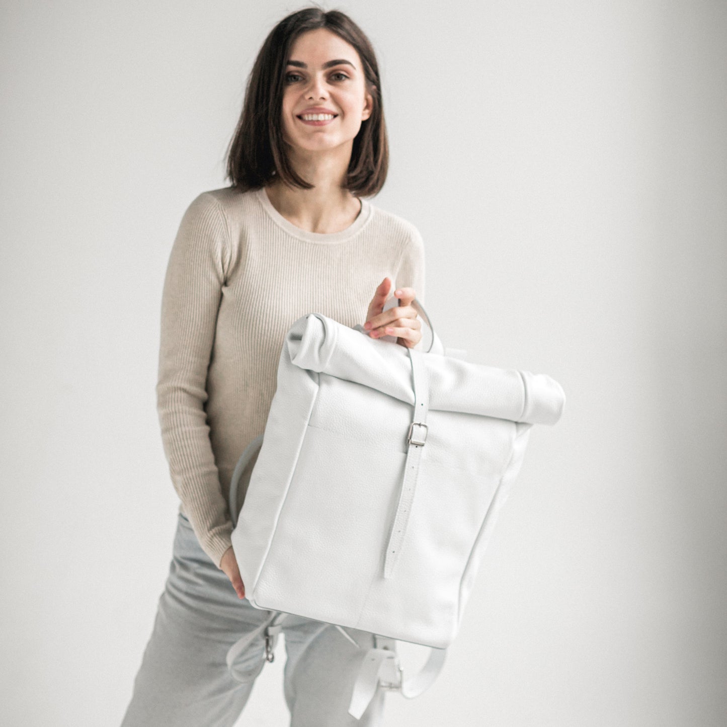 White pebbled leather roll-top backpack