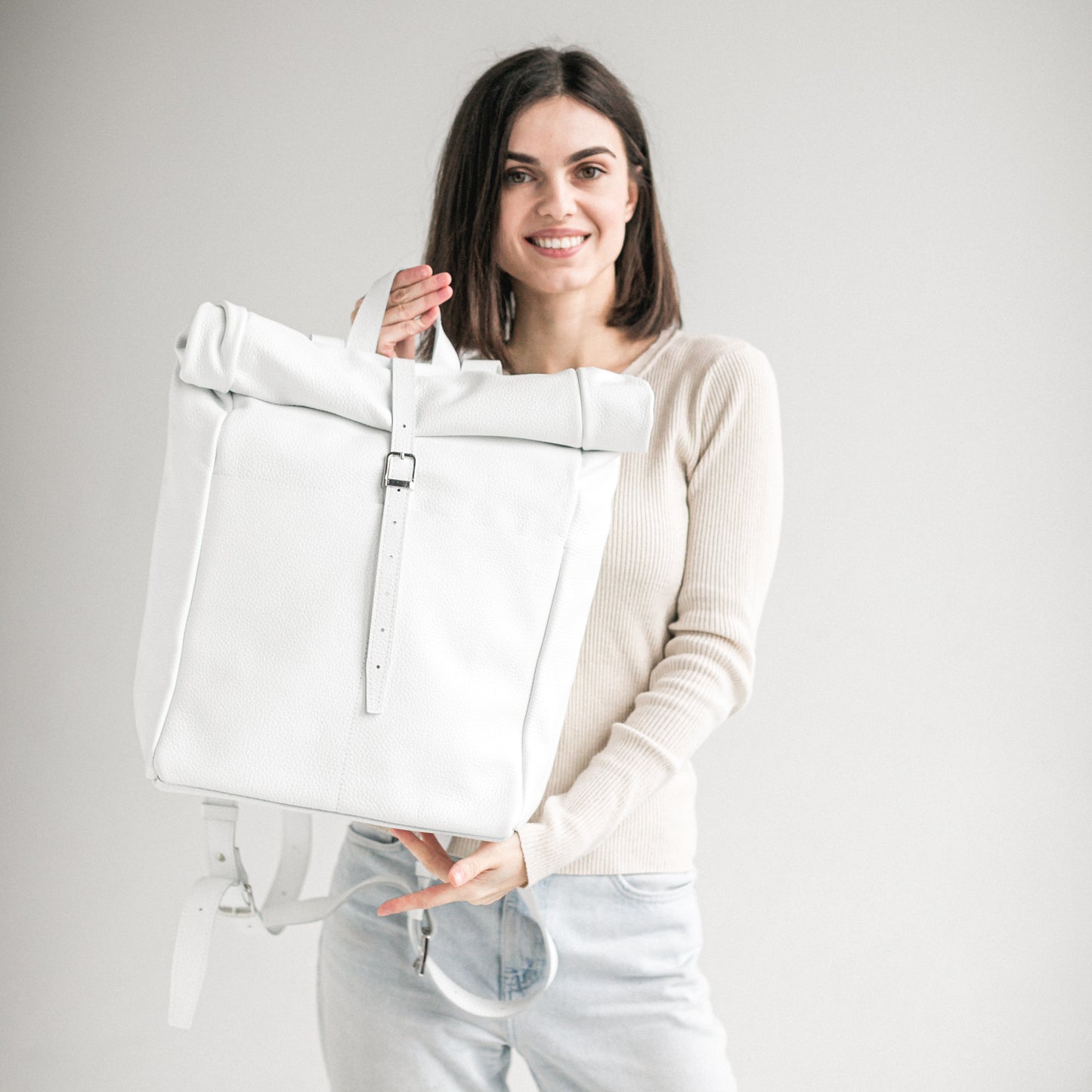 White pebbled leather roll-top backpack