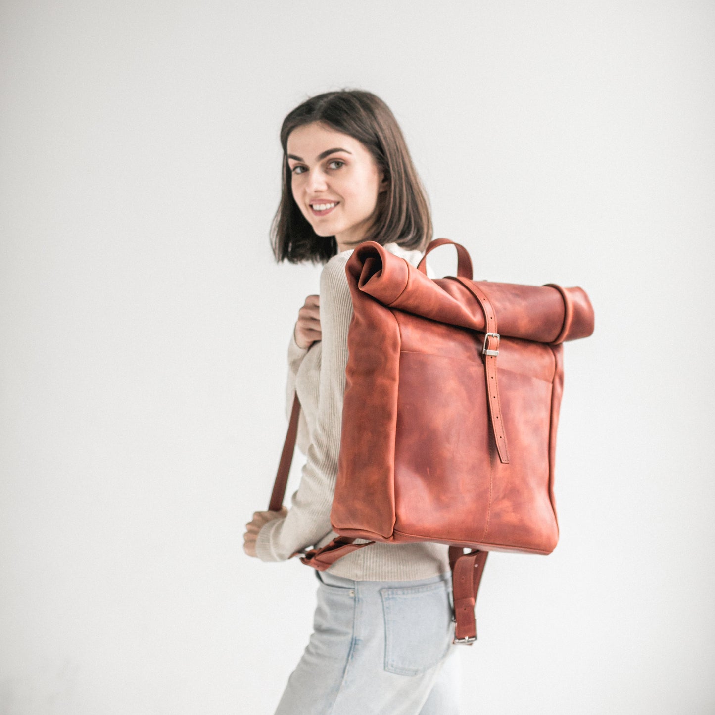 Cognac leather roll-top backpack