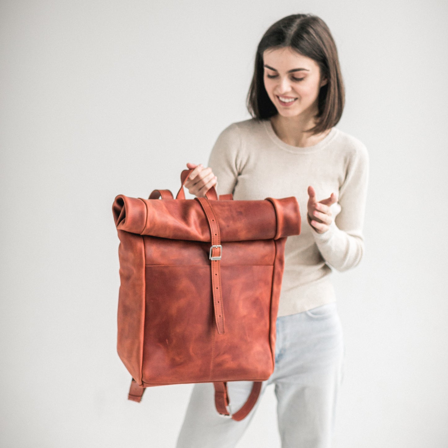 Cognac leather roll-top backpack