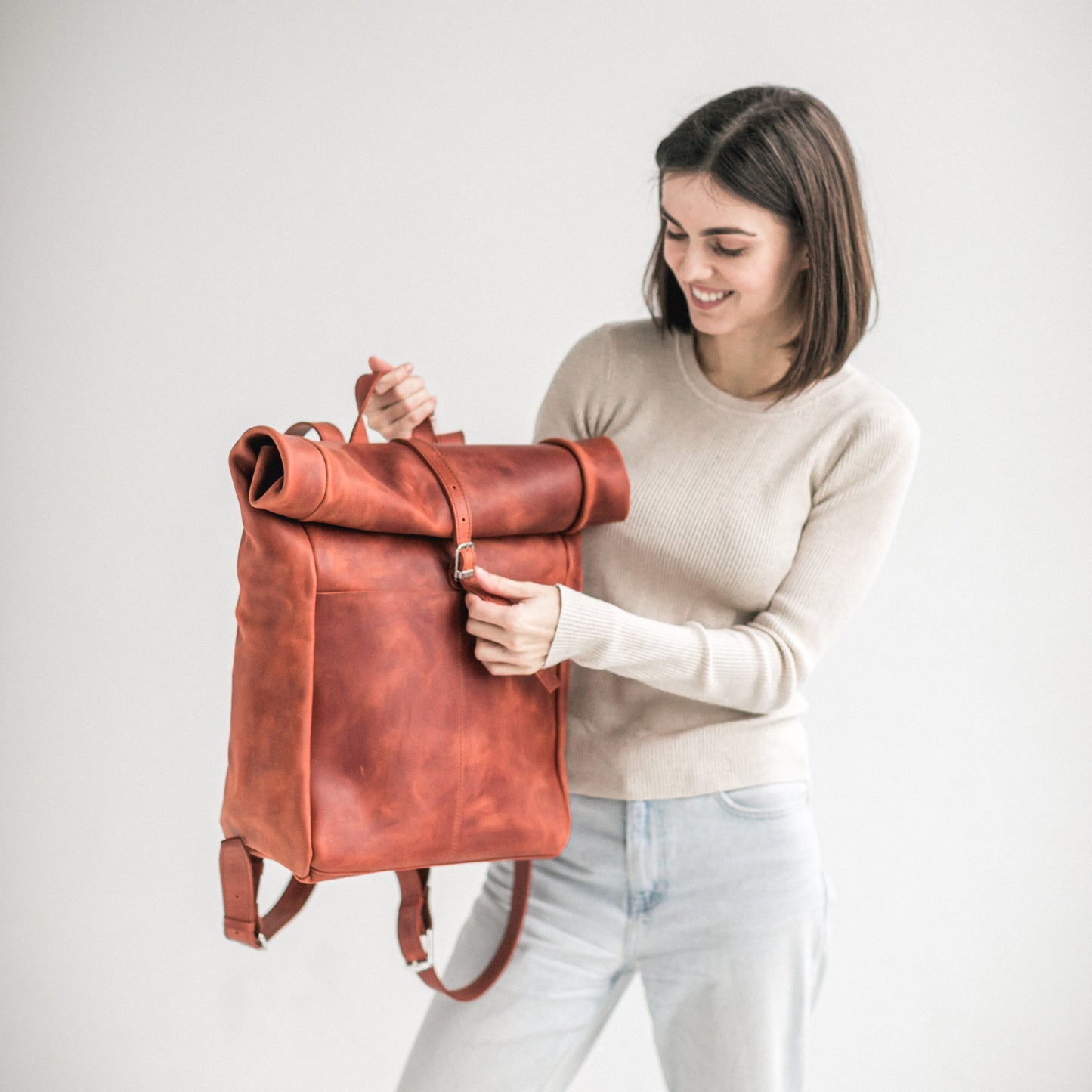 Cognac leather roll-top backpack