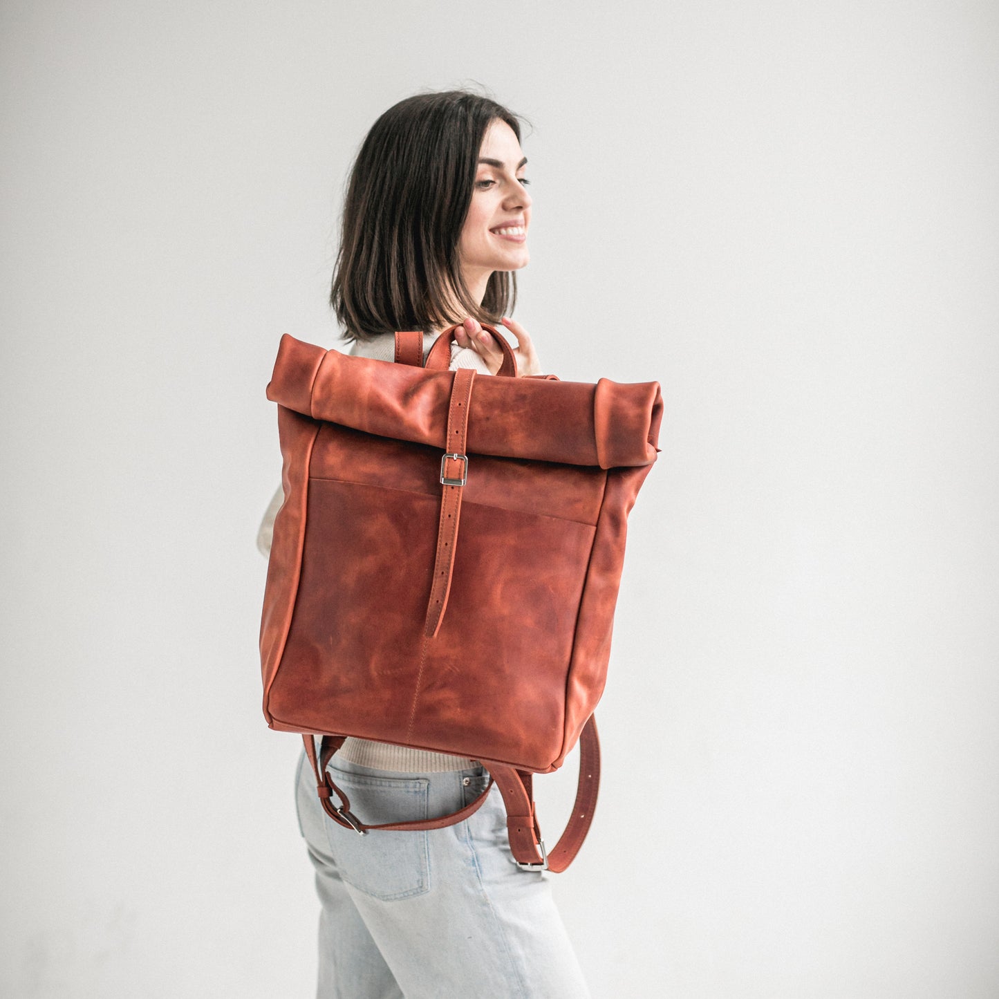 Cognac leather roll-top backpack