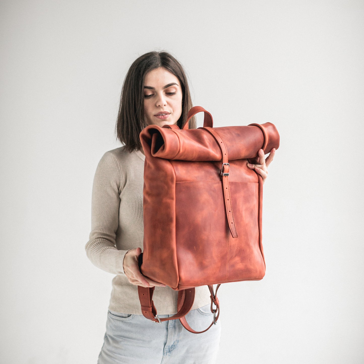 Cognac leather roll-top backpack