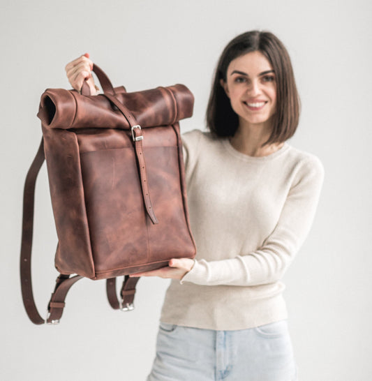 Whiskey brown leather roll-top backpack