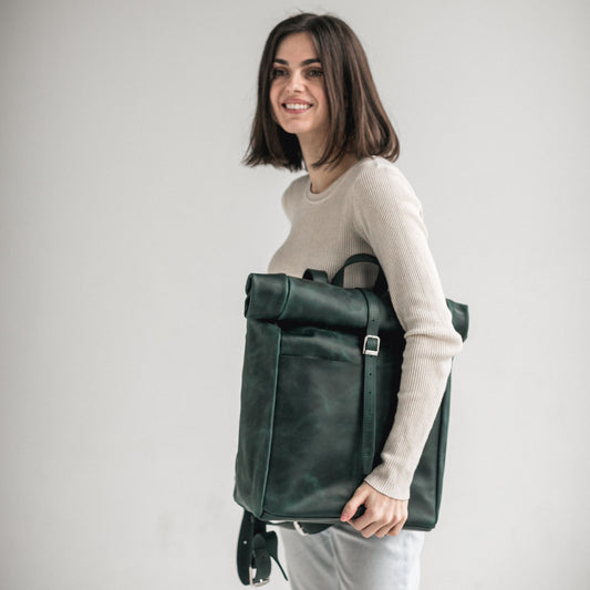 Green leather roll-top backpack