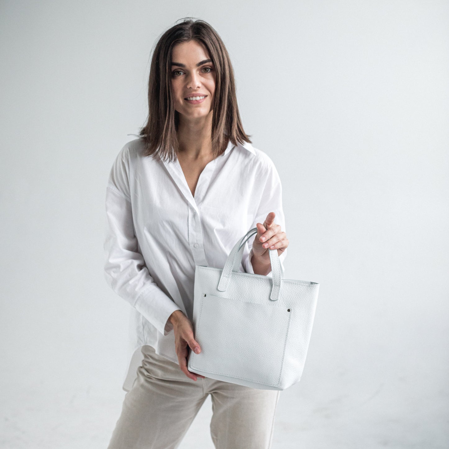 White pebbled leather mini tote bag