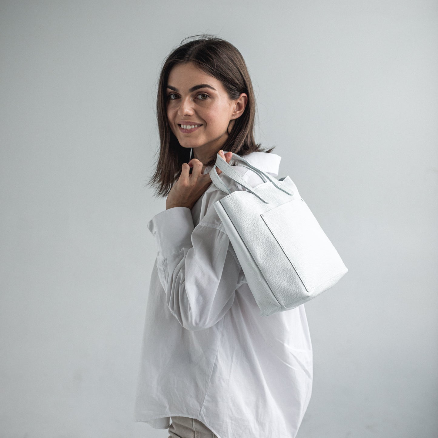 White pebbled leather mini tote bag