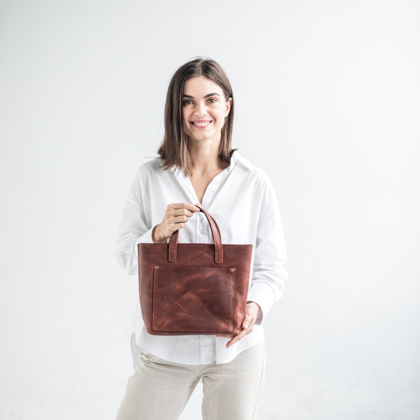 Leather mini tote bag with outside pocket 