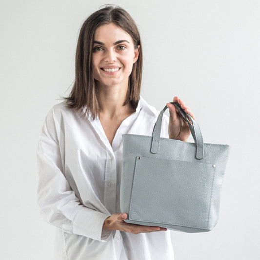 Light gray pebbled leather mini tote bag with outside pocket 