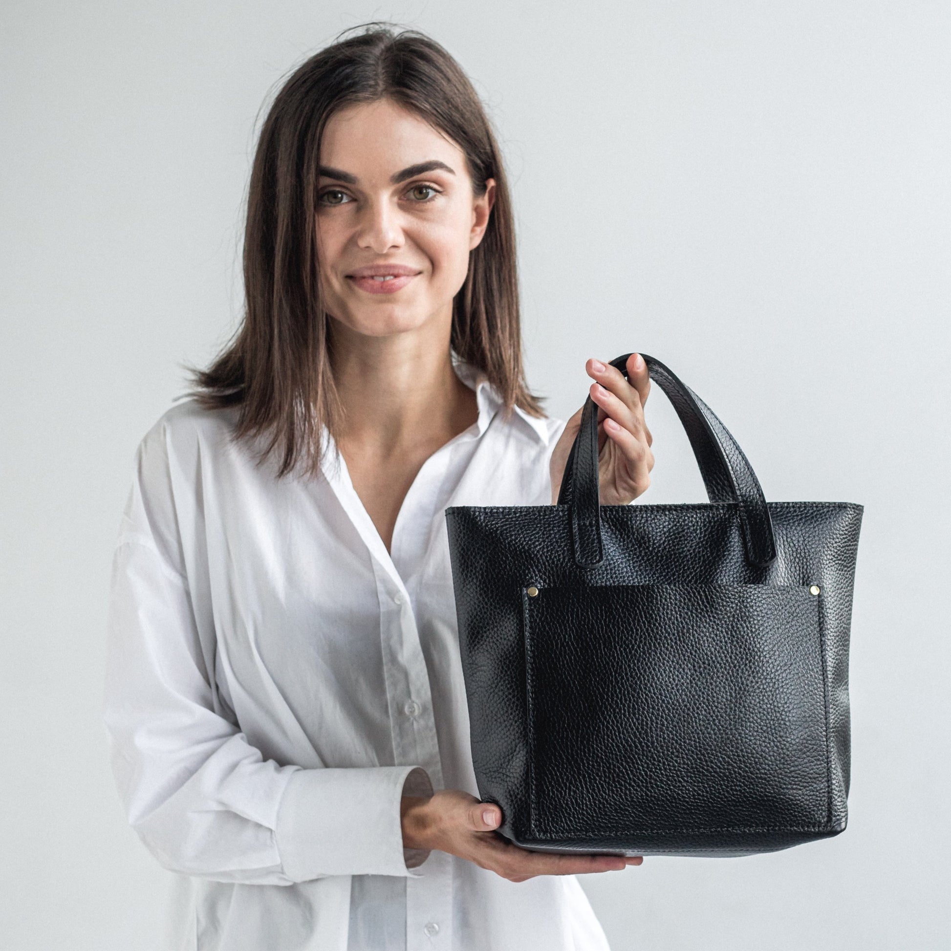 Black pebbled leather mini tote bag with zipper and outside pocket 