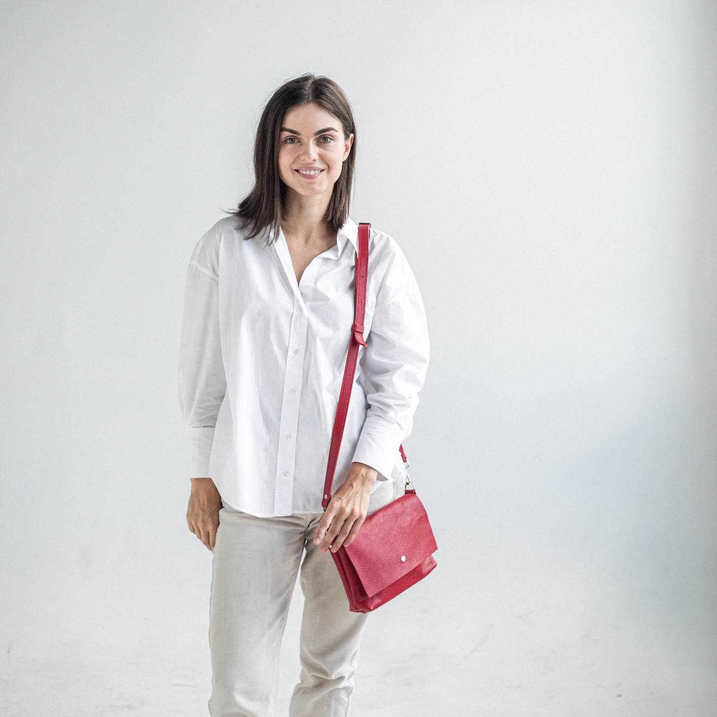 Red pebbled leather crossbody bag